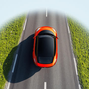 Vibrant Solitude Aerial View of a Sleek Car on a Scenic Road